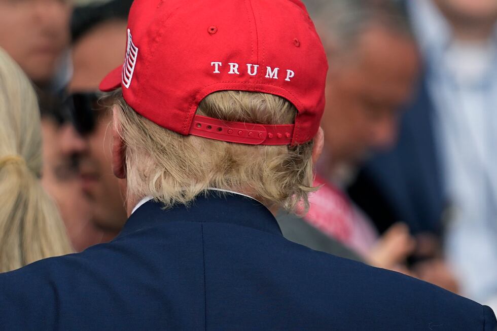 Republican presidential candidate and former President Donald Trump greets supporters after...