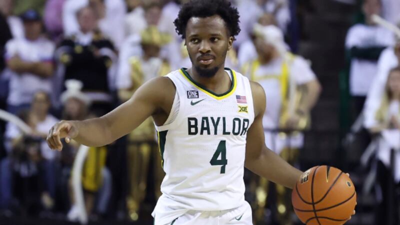 Baylor guard LJ Cryer (4) looks to pass the ball during an NCAA college basketball game...