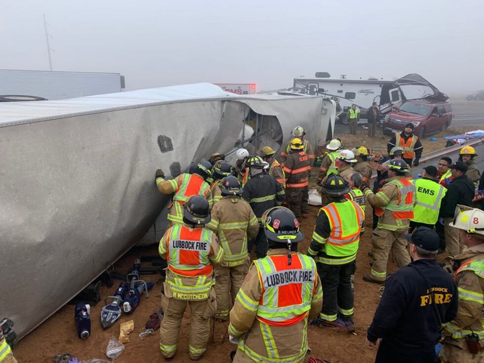 Members with the Lubbock Fire Department help out with a series of crashes east of Slaton on...